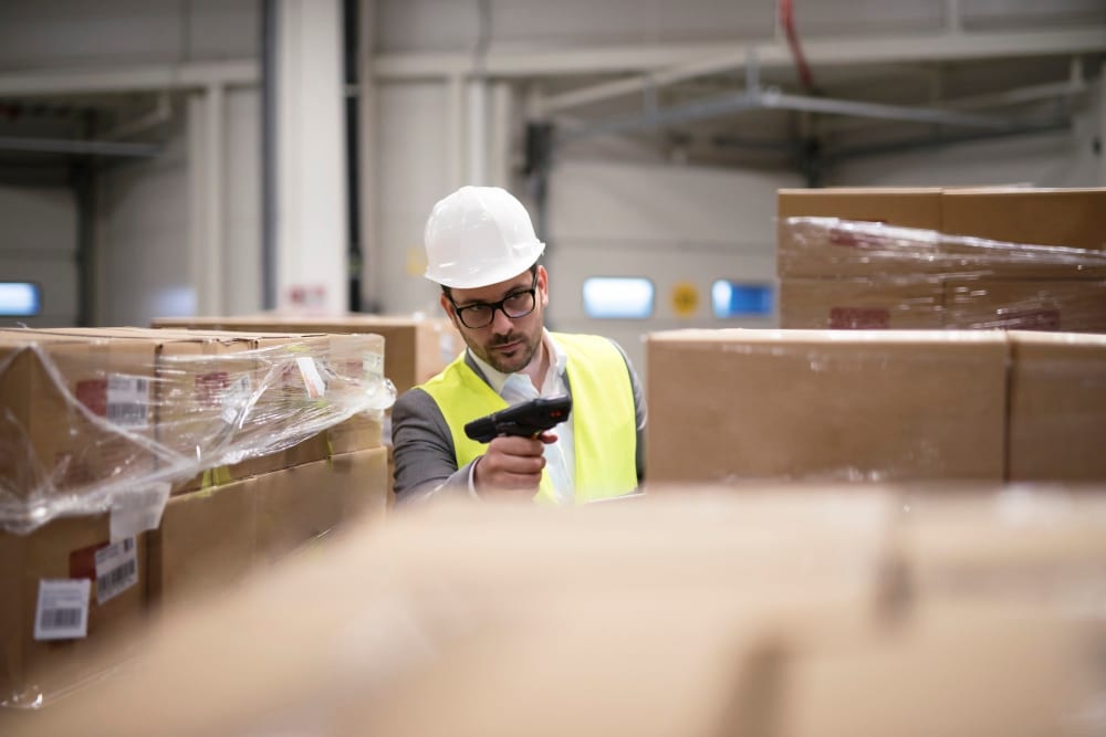 an image of a worker reading RFID stickers using a RFID stickers